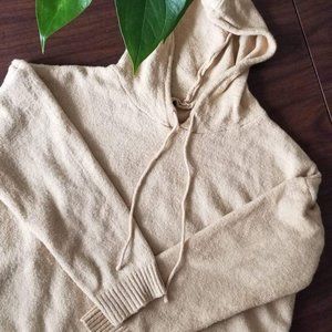 Nude warm sweater with a hood